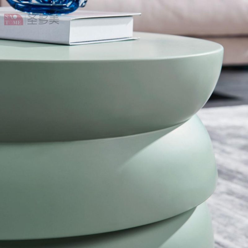 Small Round Table with Green Color Surface on Wooden Coffee Table