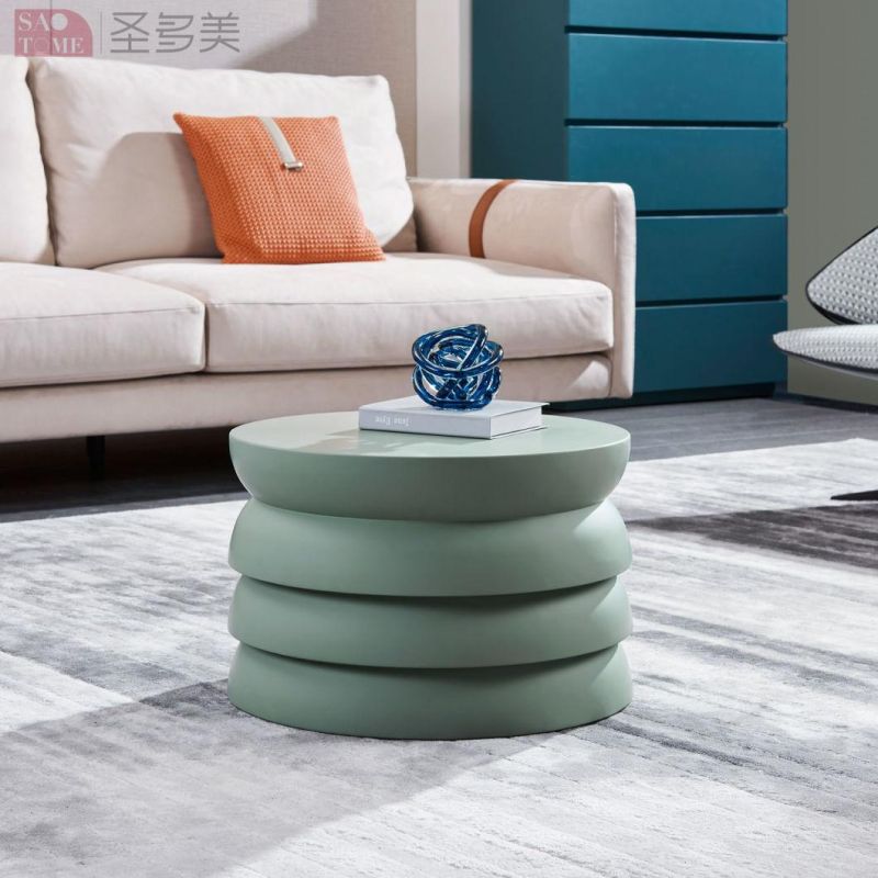 Small Round Table with Green Color Surface on Wooden Coffee Table