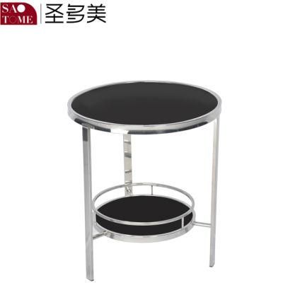 a Small Black Glass End Table That Can Be Placed Next to The Sofa
